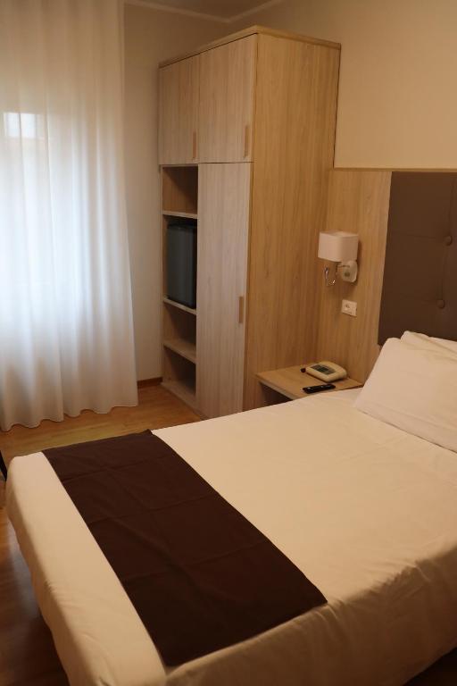 Postel nebo postele na pokoji v ubytování Hotel Montereale