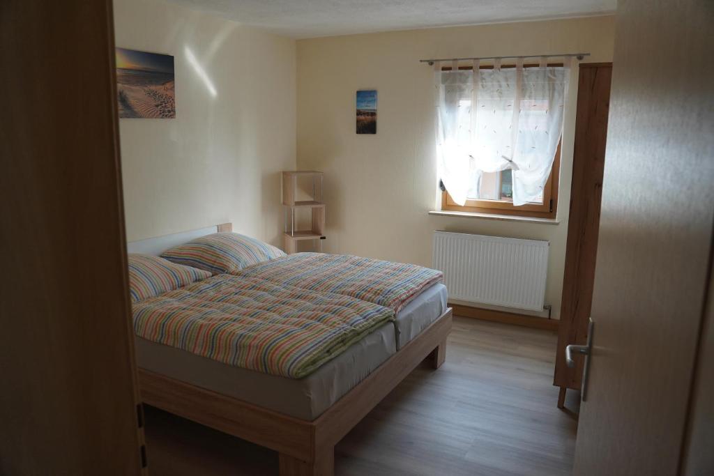 Postel nebo postele na pokoji v ubytování Ferienwohnung Sebald