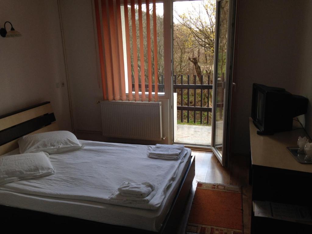 מיטה או מיטות בחדר ב-Hotel Romantik