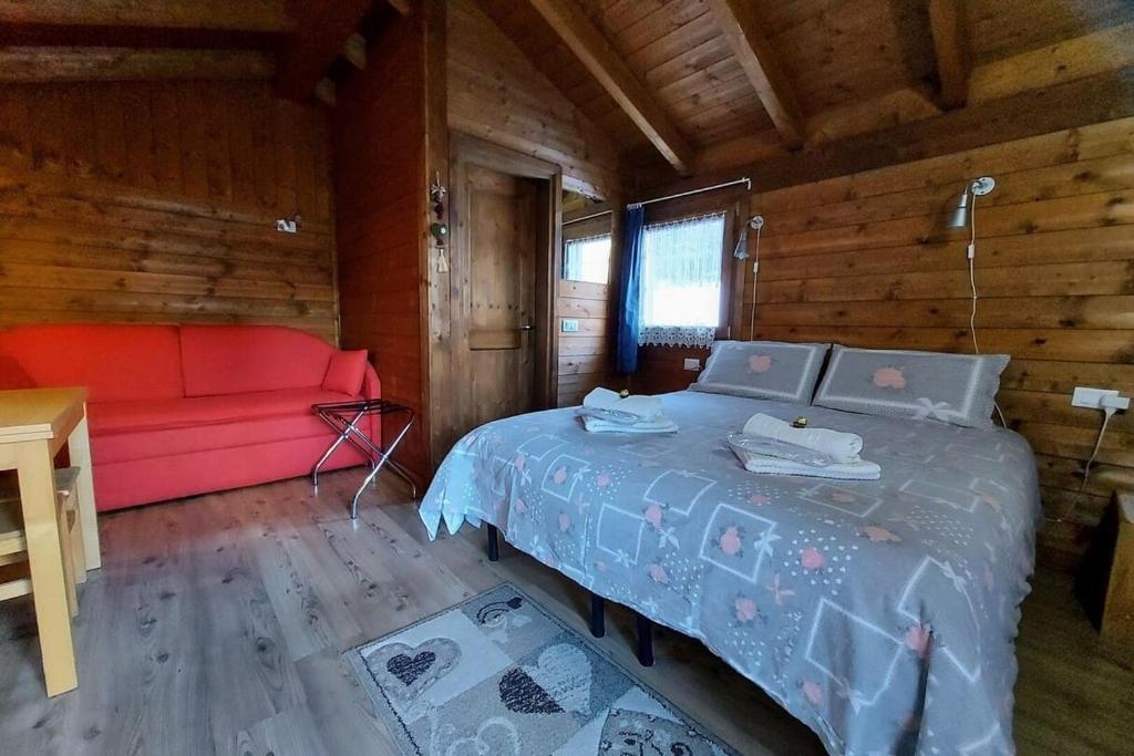 Postel nebo postele na pokoji v ubytování B&B La Genzianella