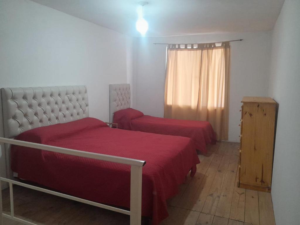 Postel nebo postele na pokoji v ubytování Laboulaye, Sarmiento 334