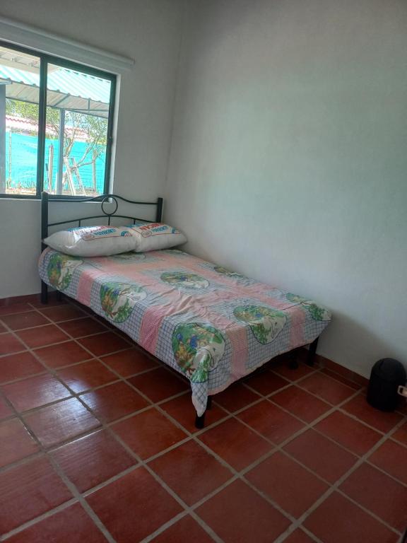 Postel nebo postele na pokoji v ubytování Finca Buganvilia