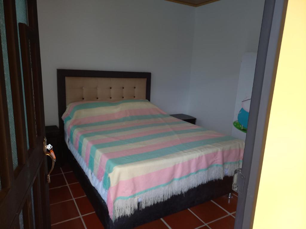 Postel nebo postele na pokoji v ubytování Finca Buganvilia