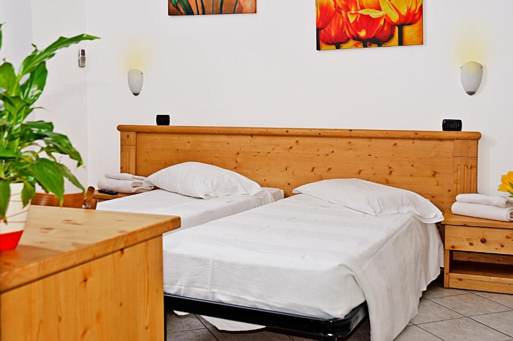 Postel nebo postele na pokoji v ubytování Borromeo Residenze Service s.a.s