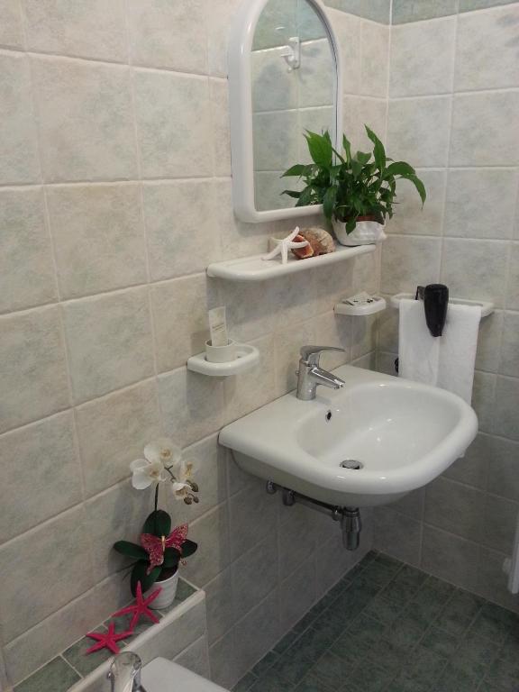 Koupelna v ubytování Hotel Maxim