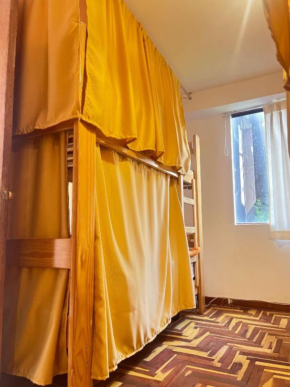 a room with a yellow curtain in a room at jtjy in San Antonio