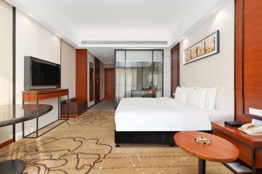 Postel nebo postele na pokoji v ubytování 深圳国际会展中心凯嘉酒店-Shenzhen Kaijia Hotel-Shenzhen-World