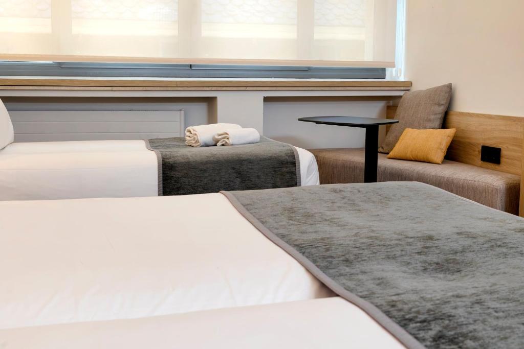 Sercotel Delfos Andorraにあるベッド