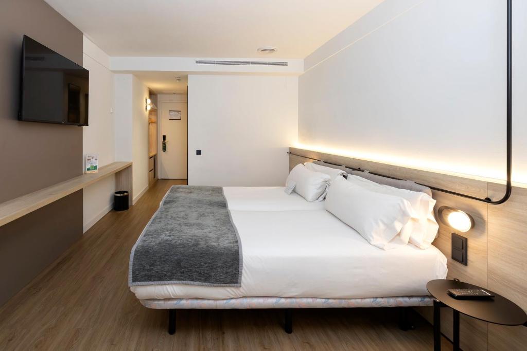Sercotel Delfos Andorraにあるベッド