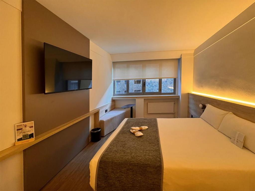Sercotel Delfos Andorraにあるベッド