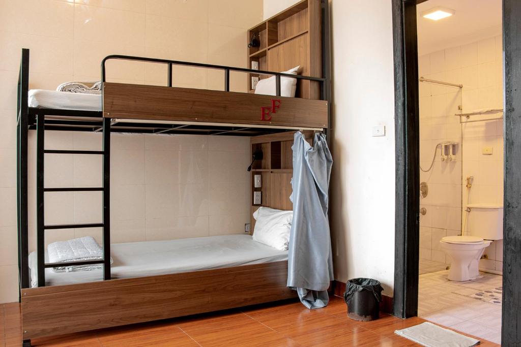 Postel nebo postele na pokoji v ubytování Group Nest Hotel