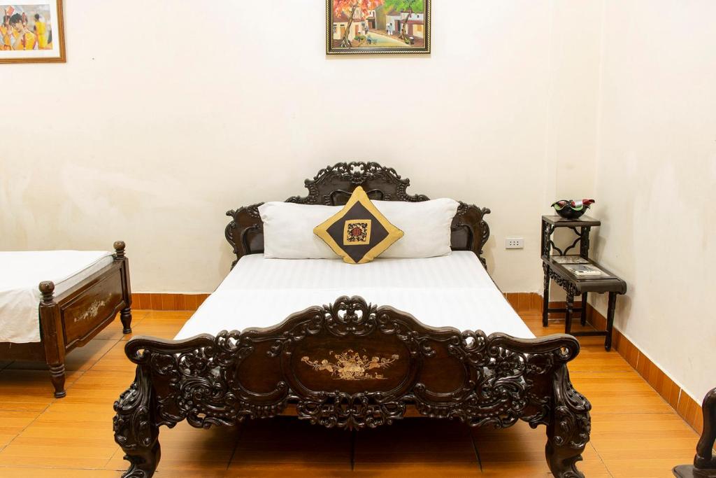 Postel nebo postele na pokoji v ubytování Group Nest Hotel