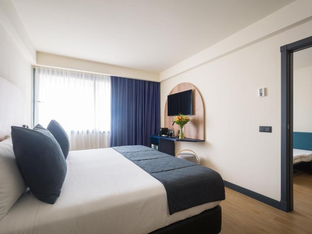 Postel nebo postele na pokoji v ubytování Sercotel Playa Canteras