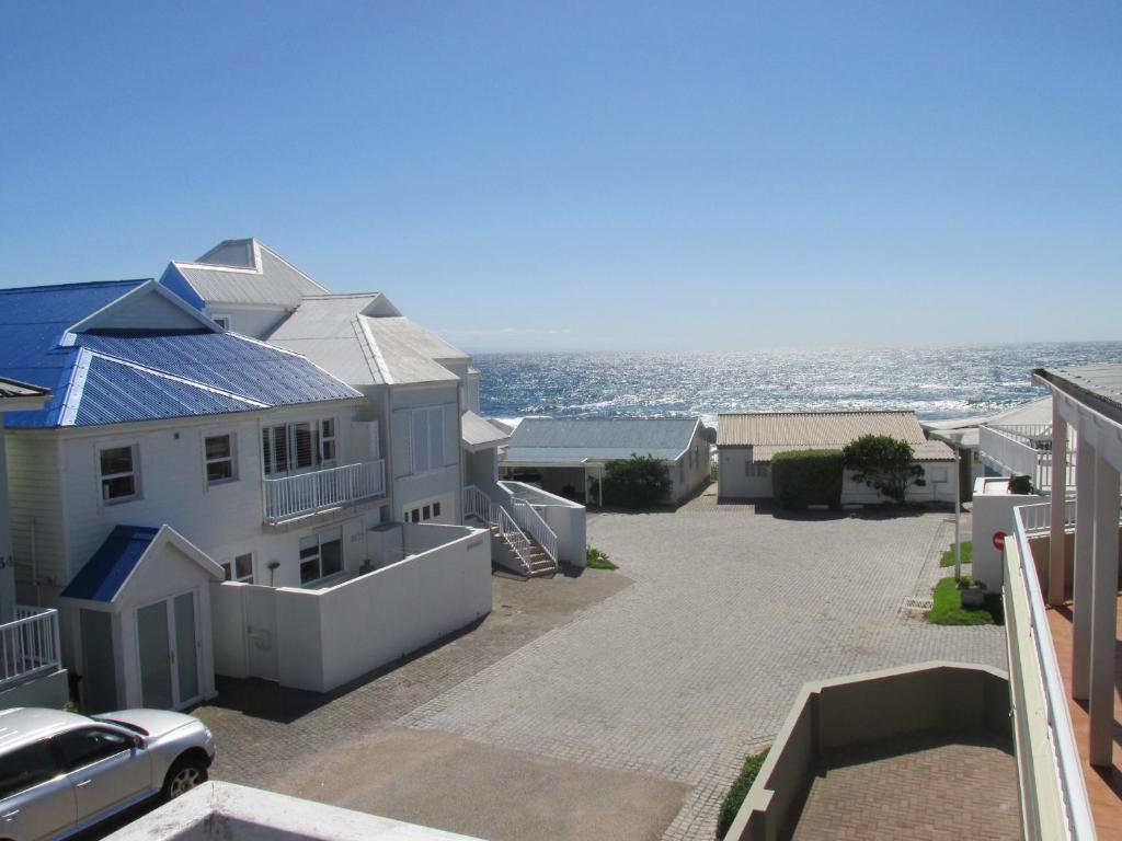 a house with a solar roof on top of it at Point Village Accommodation - Hennie Top in Mossel Bay