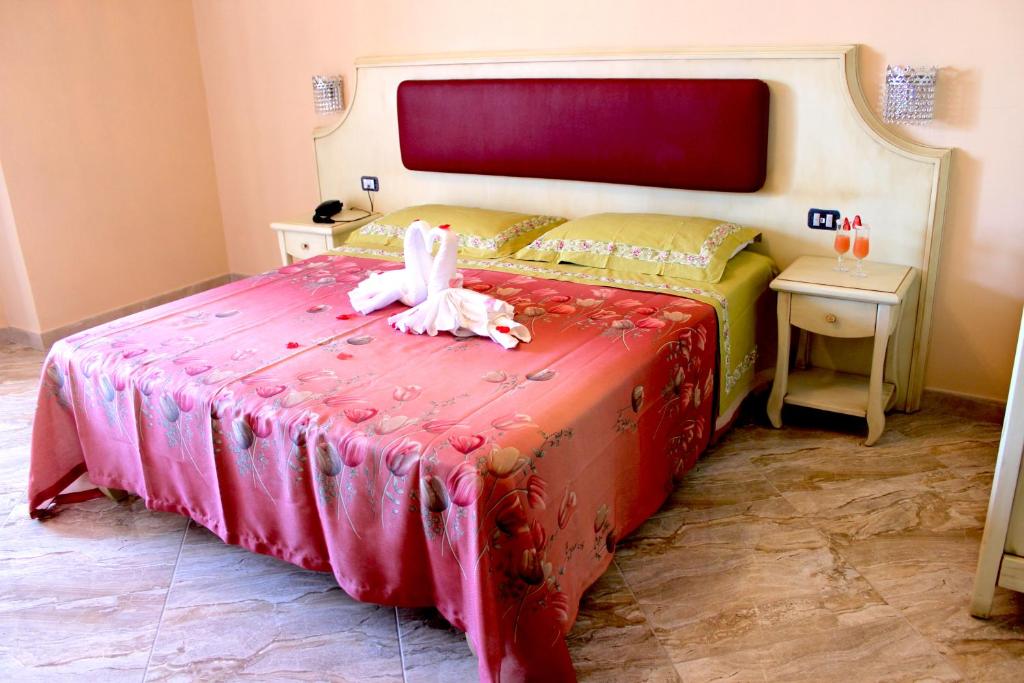 Postel nebo postele na pokoji v ubytování Hotel Terrazzo Sul Mare