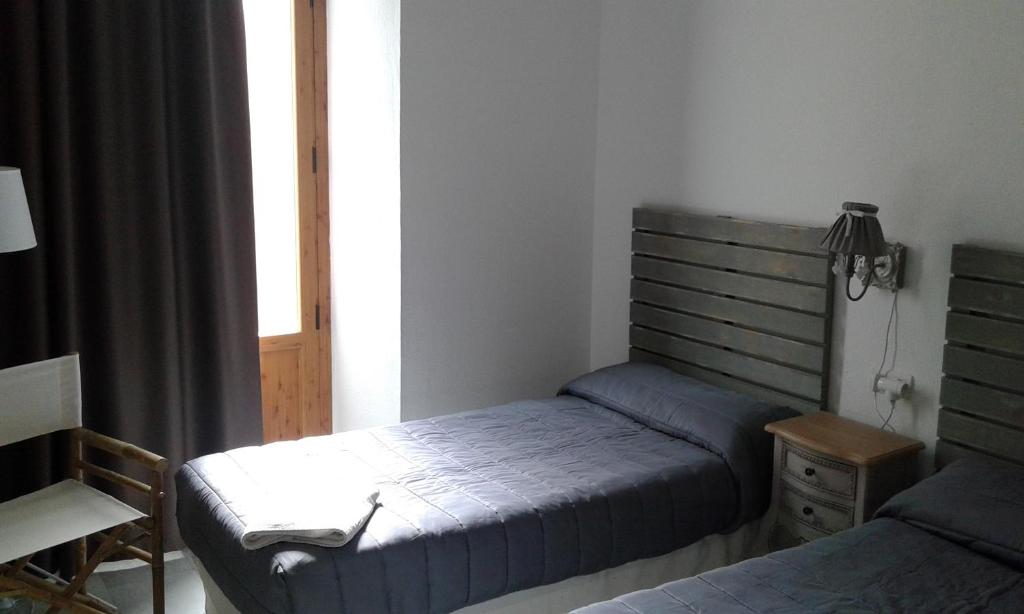 Postel nebo postele na pokoji v ubytování Granada Old Town Hostel