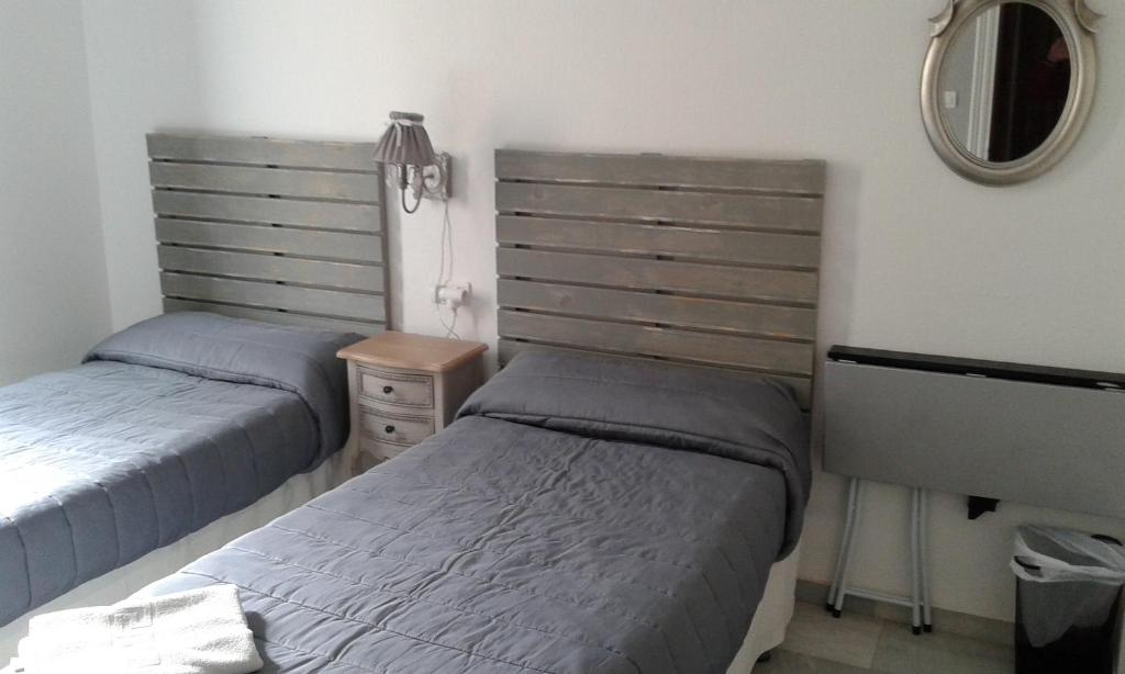 Postel nebo postele na pokoji v ubytování Granada Old Town Hostel
