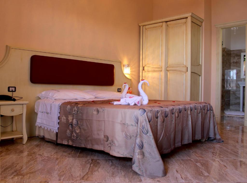 Postel nebo postele na pokoji v ubytování Hotel Terrazzo Sul Mare
