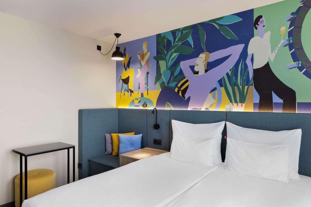 Łóżko lub łóżka w pokoju w obiekcie Spark by Hilton Vienna Messe Prater