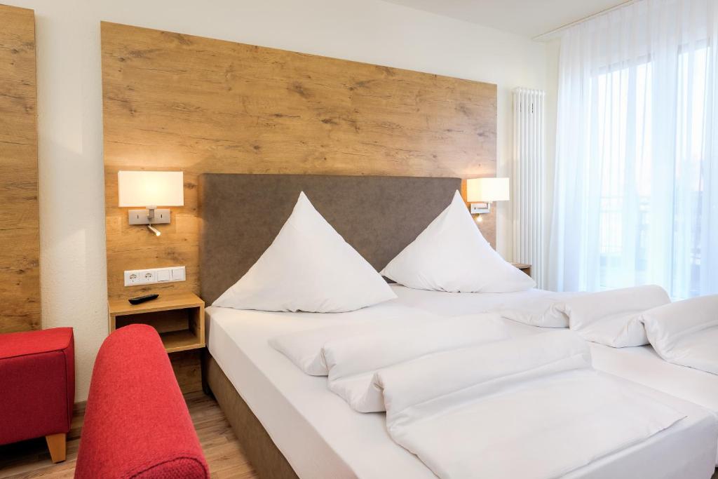 Postel nebo postele na pokoji v ubytování Hotel Mythos