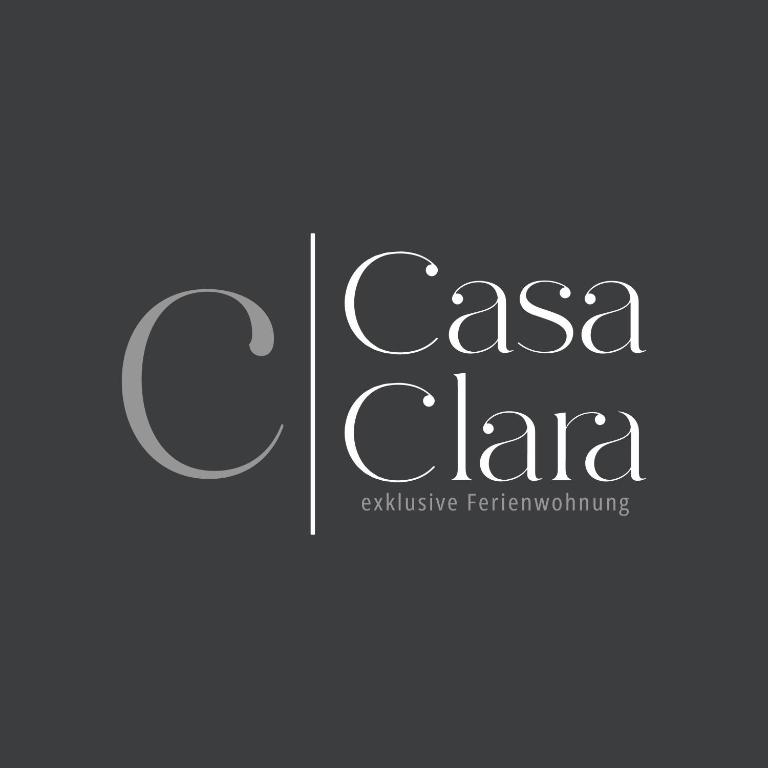 a logo for a csa clara sustainable furniture building at Casa Clara - Exklusive Ferienwohnung in Hennweiler