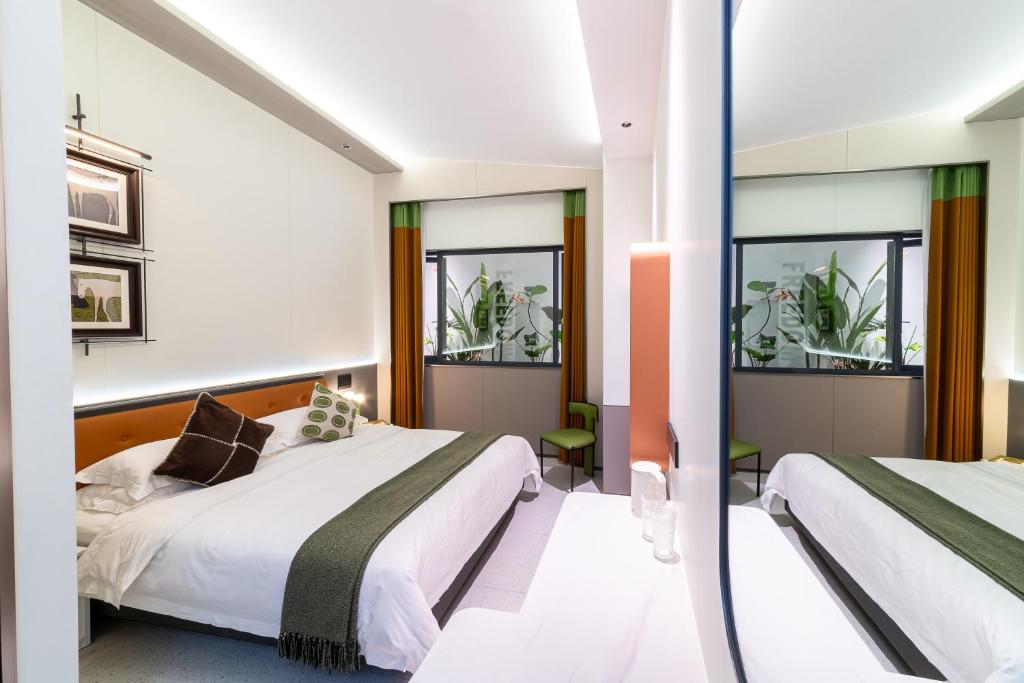 Postel nebo postele na pokoji v ubytování Vishan Keys Hotel 维尚潮宿