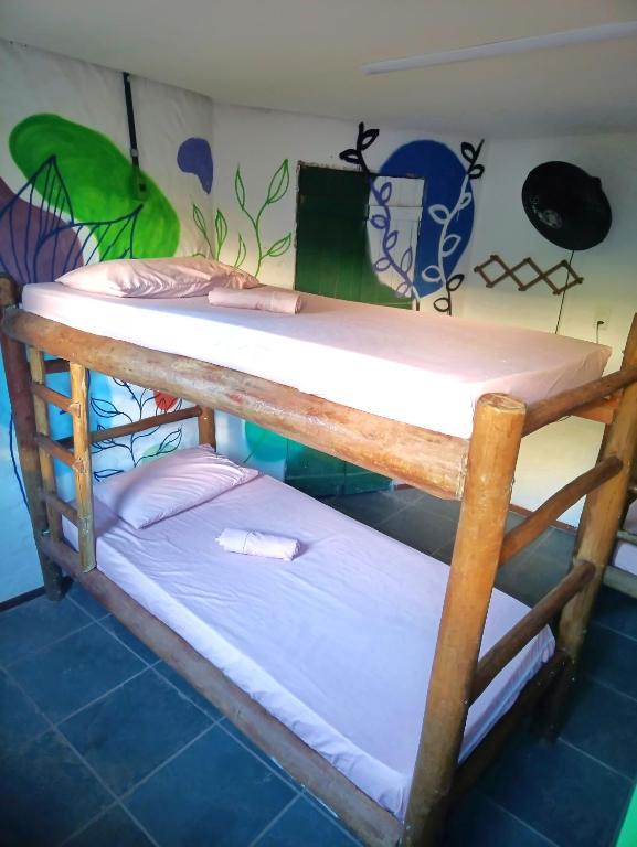 Postel nebo postele na pokoji v ubytování Covil das Trilhas