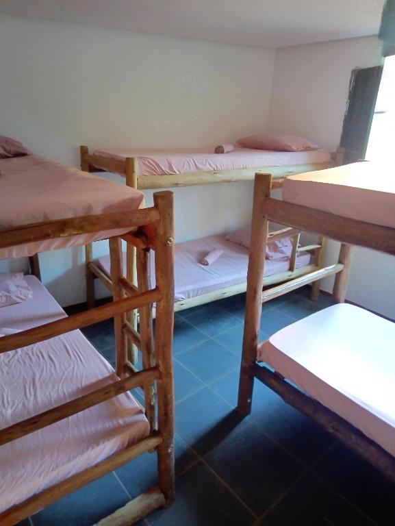 Postel nebo postele na pokoji v ubytování Covil das Trilhas