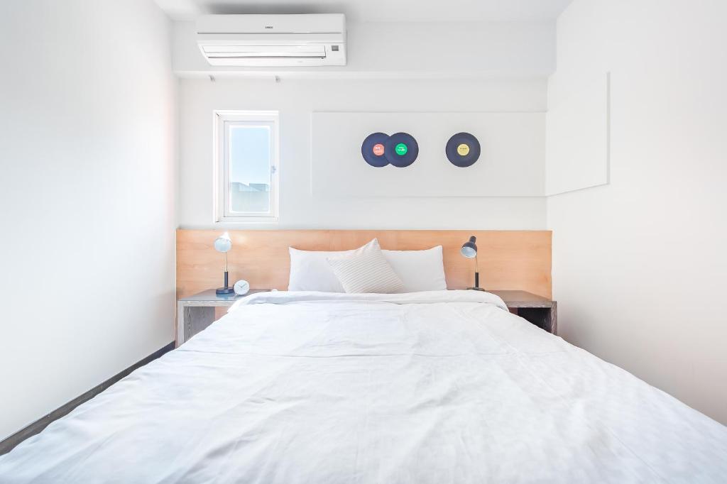 Postel nebo postele na pokoji v ubytování Penghu Sea Residences Hall