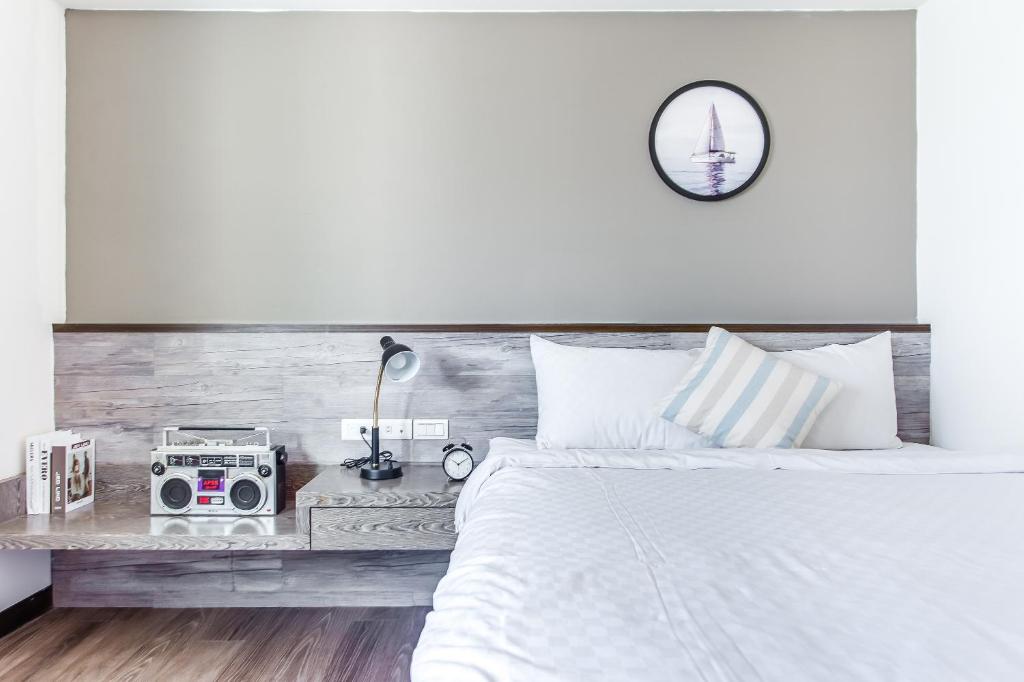 Postel nebo postele na pokoji v ubytování Penghu Sea Residences Hall