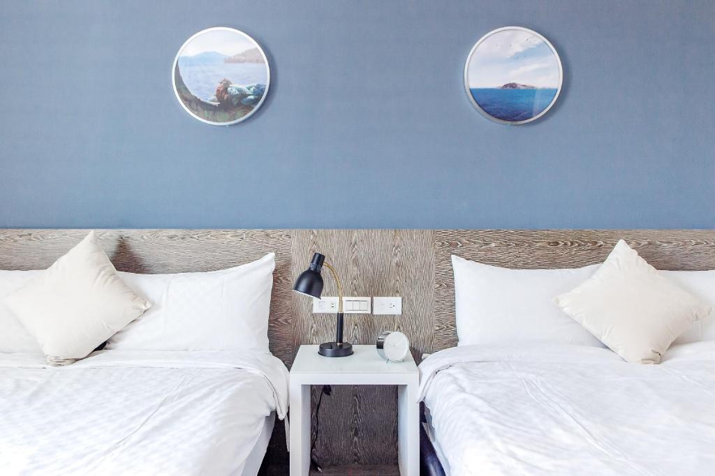 Postel nebo postele na pokoji v ubytování Penghu Sea Residences Hall