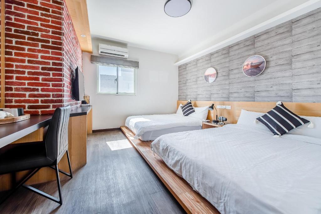 Postel nebo postele na pokoji v ubytování Penghu Sea Residences Hall