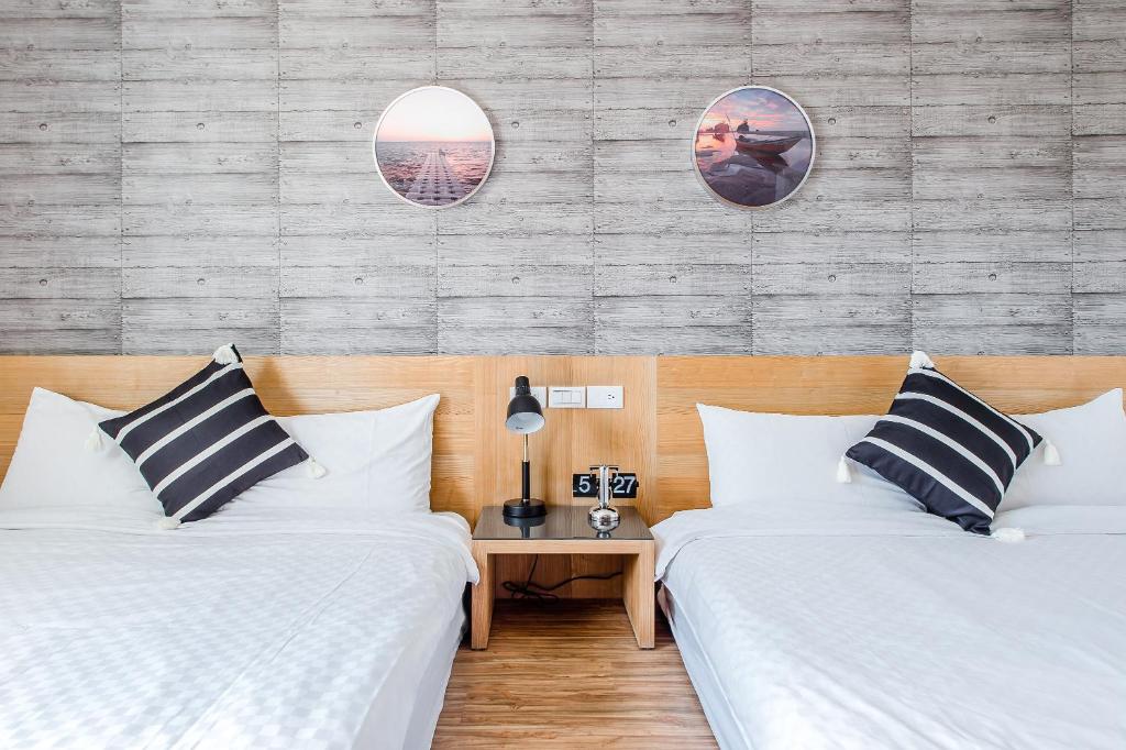 Postel nebo postele na pokoji v ubytování Penghu Sea Residences Hall