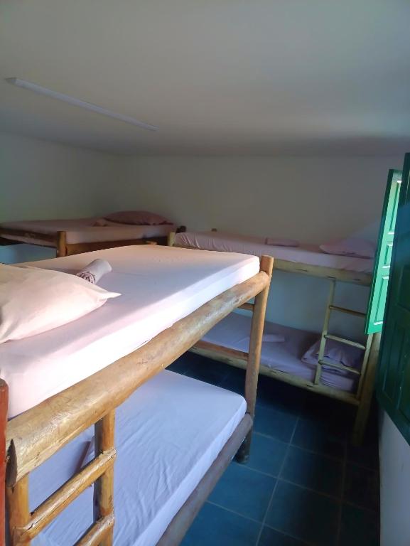 Postel nebo postele na pokoji v ubytování Covil das Trilhas