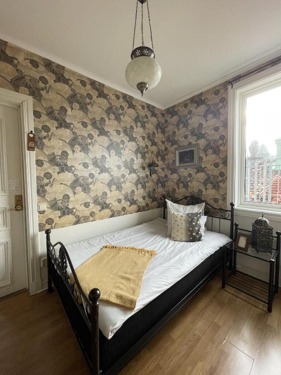 Postel nebo postele na pokoji v ubytování Grand Hotel Lysekil