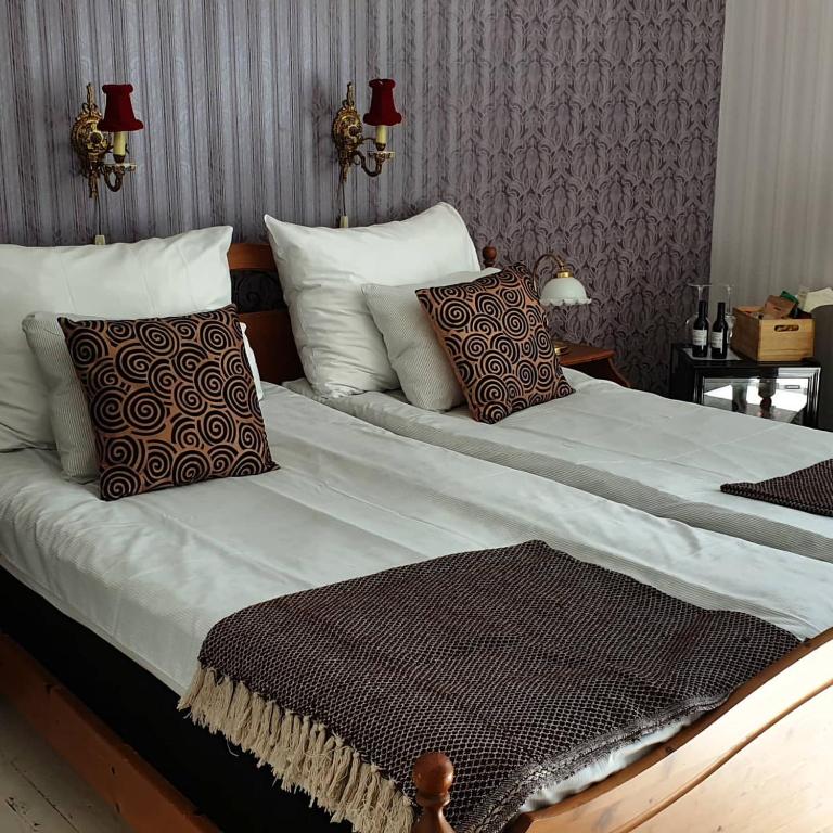 Postel nebo postele na pokoji v ubytování Grand Hotel Lysekil