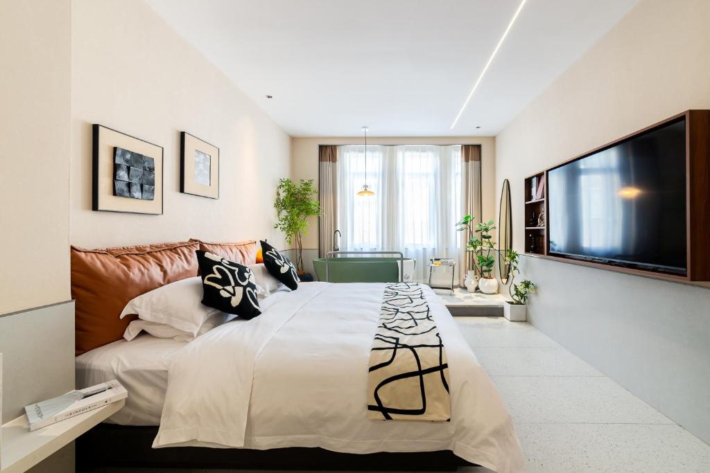 Postel nebo postele na pokoji v ubytování Vishan Keys Hotel 维尚潮宿