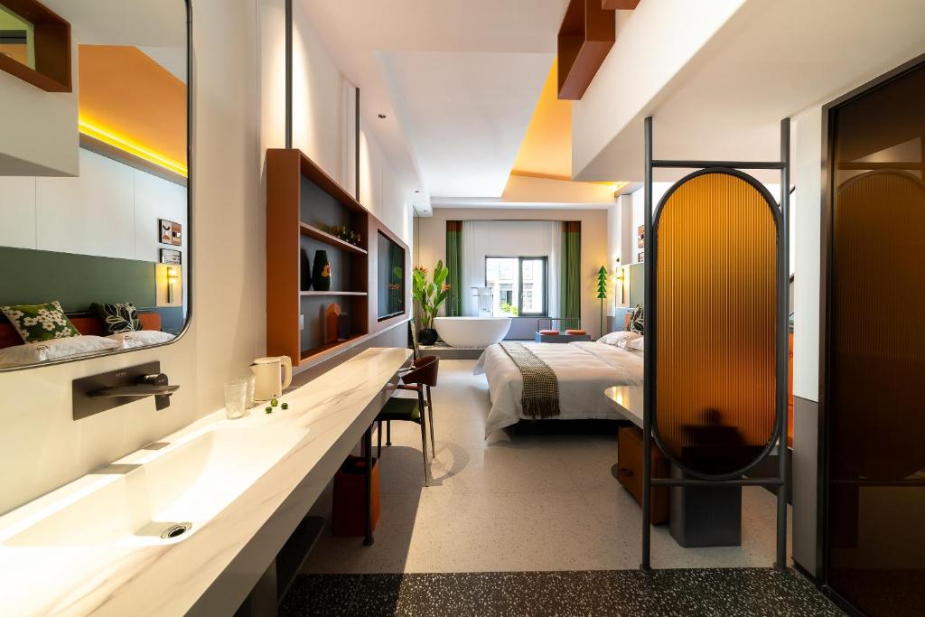 Postel nebo postele na pokoji v ubytování Vishan Keys Hotel 维尚潮宿