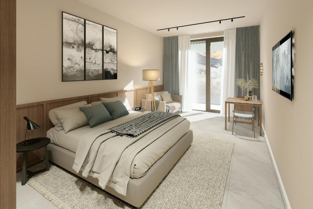 a bedroom with a bed and a desk in it at Appartement Chalet Saalbach in Saalbach Hinterglemm