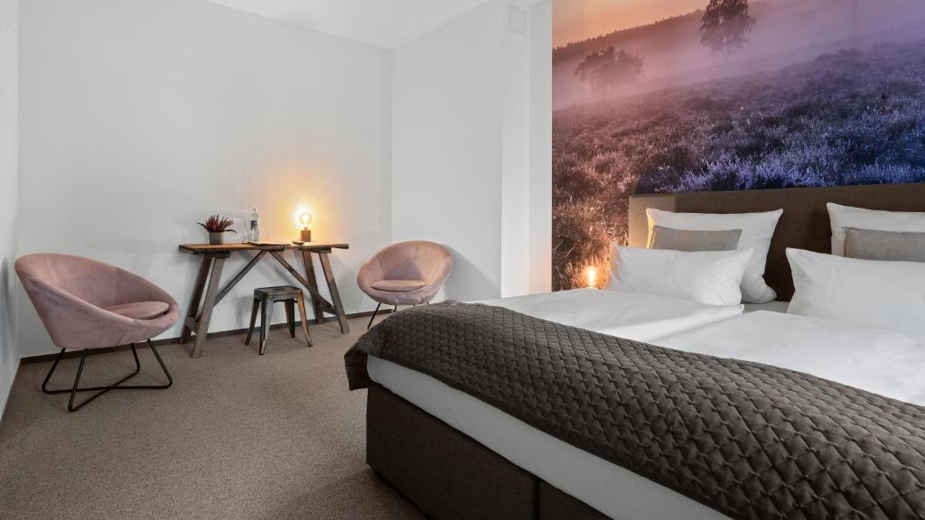 Postel nebo postele na pokoji v ubytování Alpine Hotel