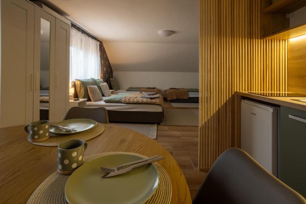 Postel nebo postele na pokoji v ubytování RP Apartmanház