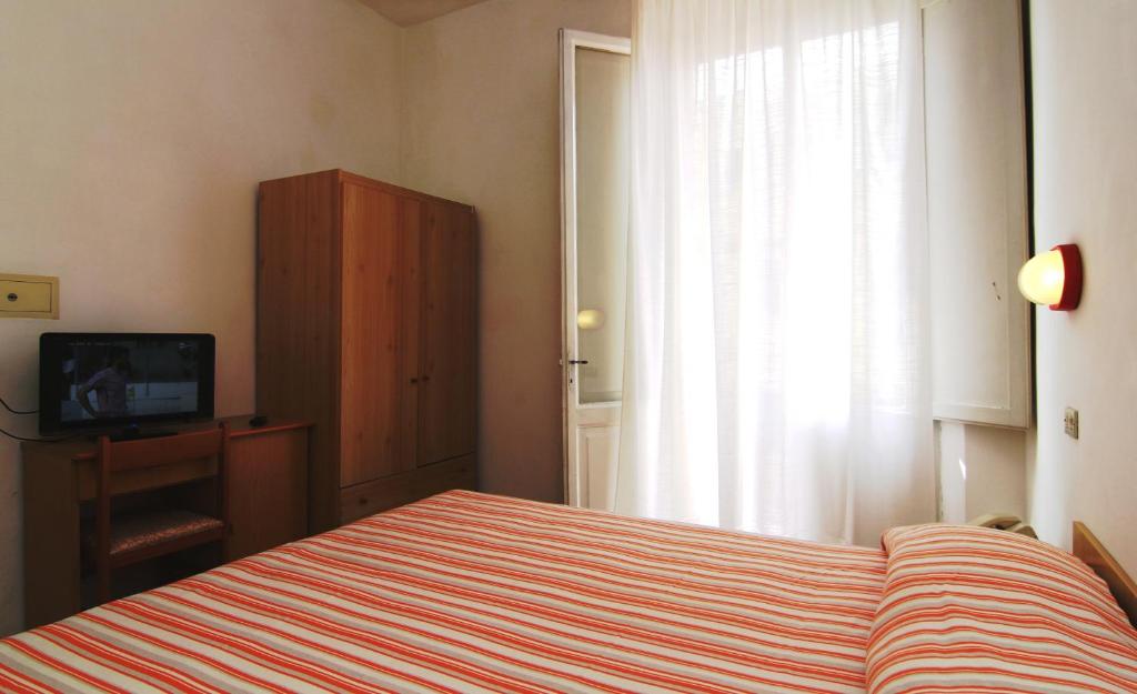 Postel nebo postele na pokoji v ubytování Hotel Garni Picnic