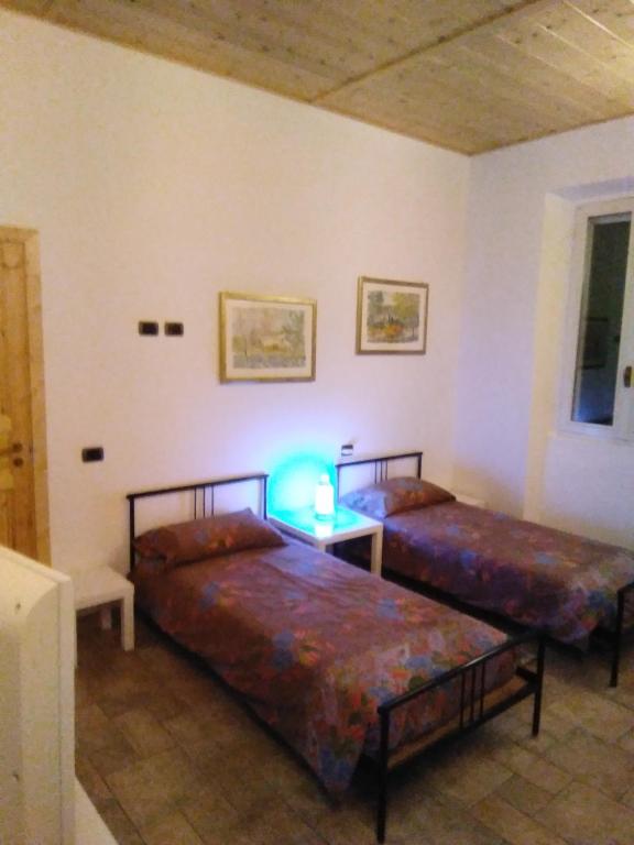Postel nebo postele na pokoji v ubytování BeB cascina Mentirone