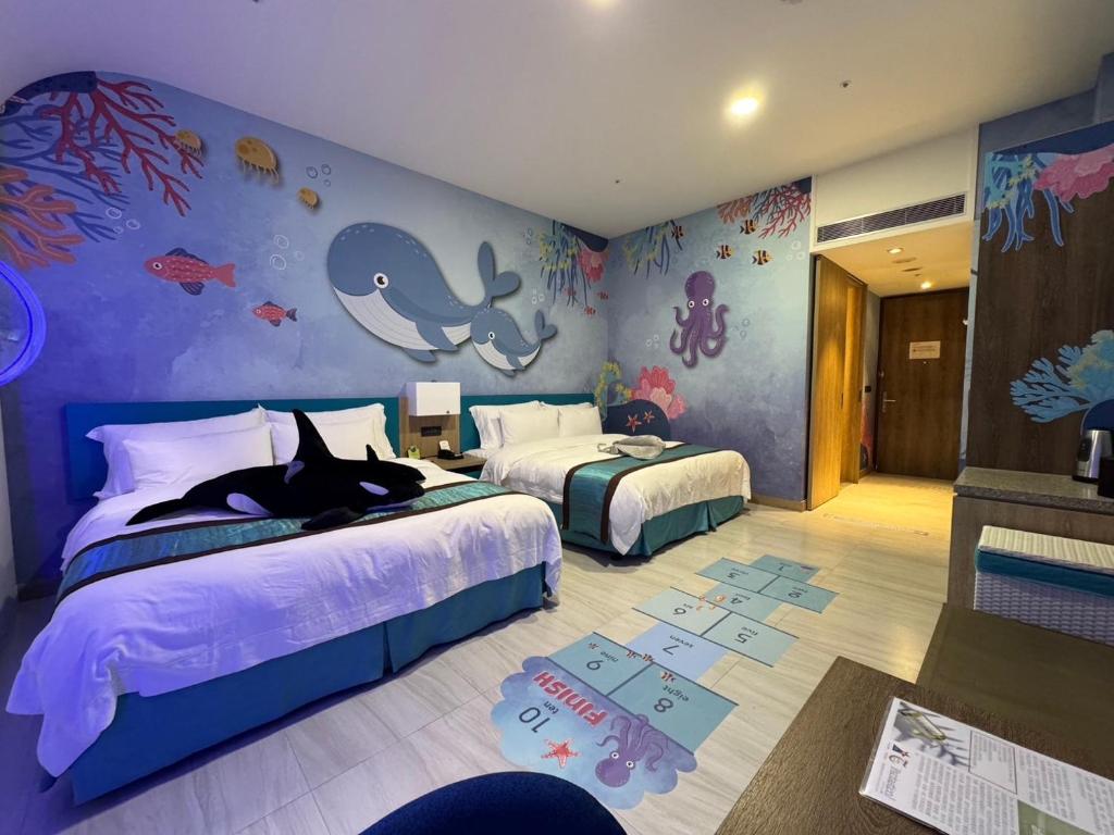 Postel nebo postele na pokoji v ubytování Fullon Hotel Fulong