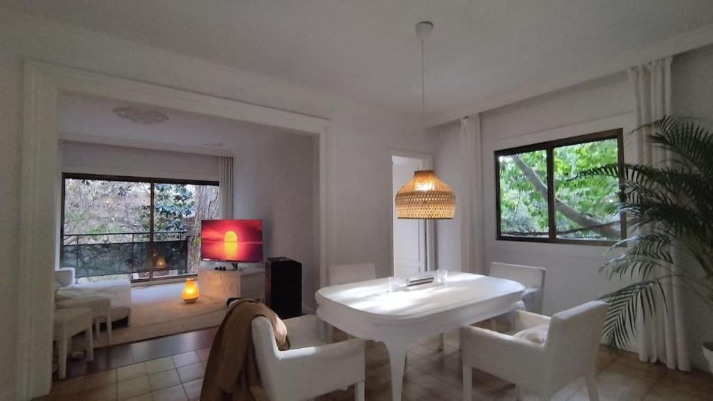 a living room with a white table and chairs at Big House on Barcelona s Border in Hospitalet de Llobregat