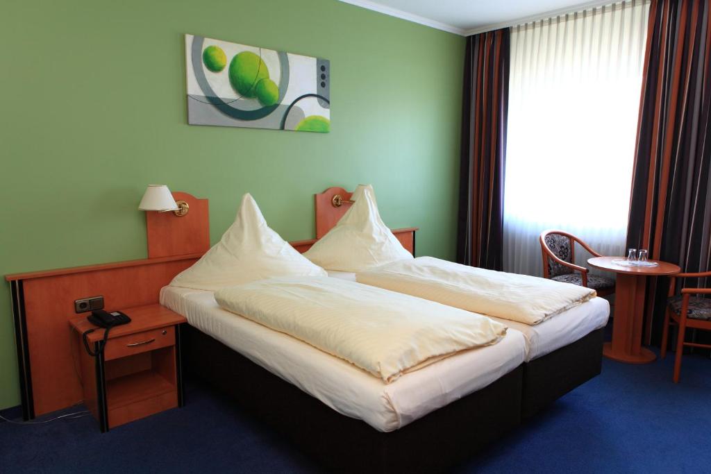 Postel nebo postele na pokoji v ubytování Hotel Boulevard