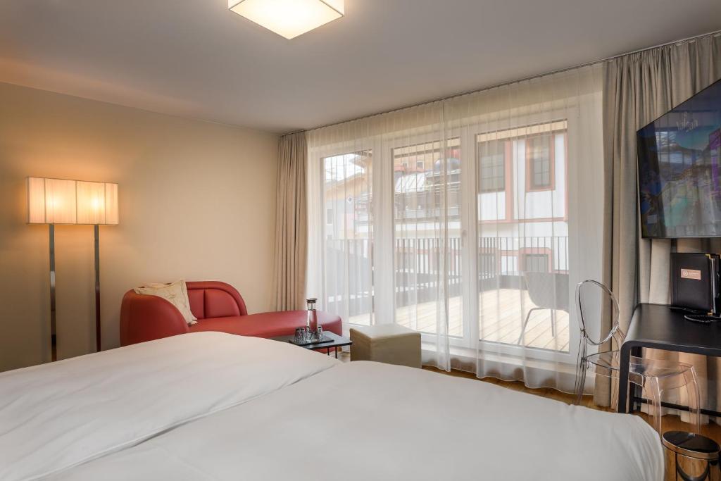 Posteľ alebo postele v izbe v ubytovaní Alpinresort ValSaa - Sport & Spa