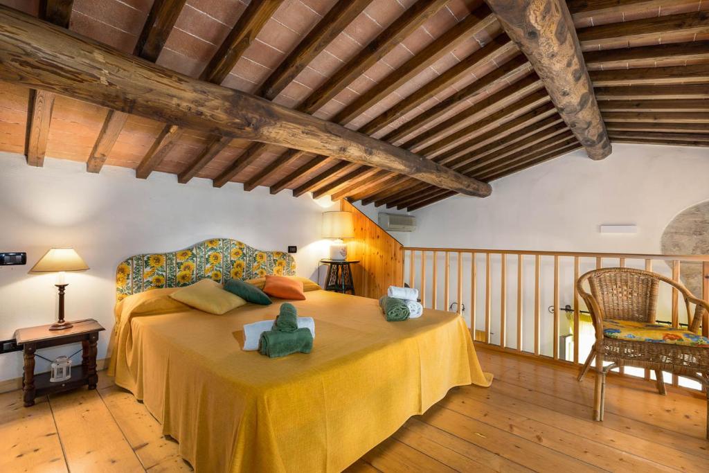 Postel nebo postele na pokoji v ubytování Relais Antico Borgo San Lorenzo