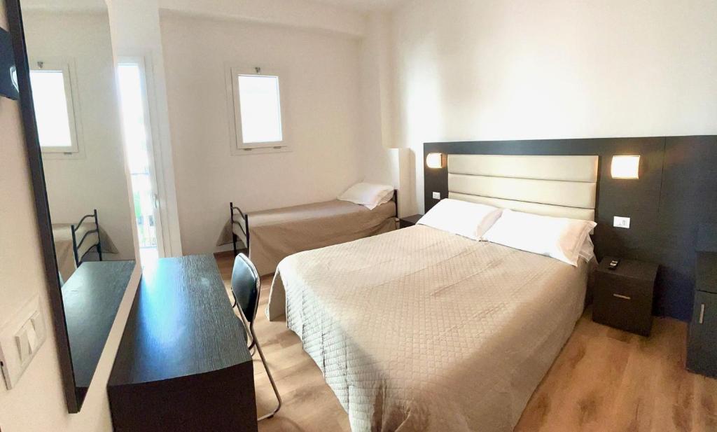 Postel nebo postele na pokoji v ubytování Hotel Niagara