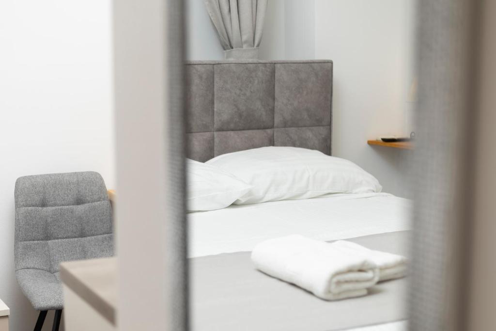 Posteľ alebo postele v izbe v ubytovaní Split Varos Inn